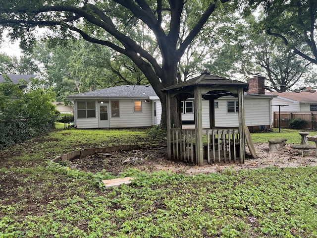 1846 S Nettleton Ave, Springfield, MO 65807 - rear view of property featuring a chimney