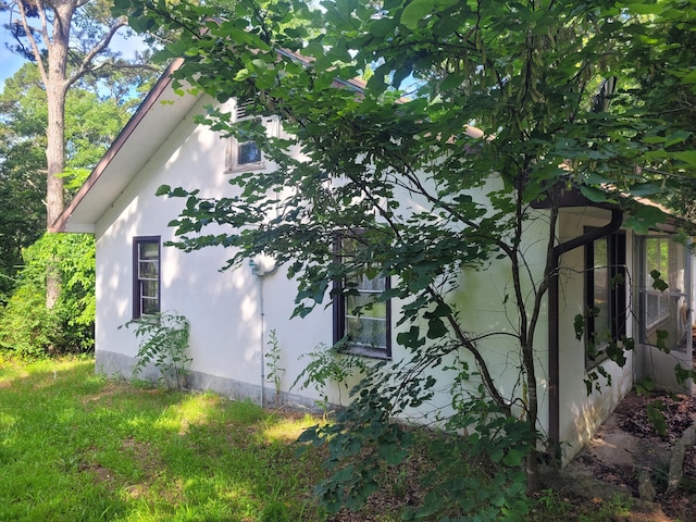 view of home's exterior with stucco siding