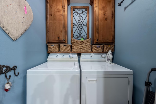 1021 W Whiteside St, Springfield, MO 65807 - laundry room with cabinet space and washer and clothes dryer