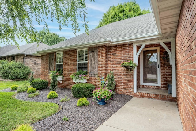 1021 W Whiteside St, Springfield, MO 65807 - property entrance with roof with shingles and brick siding