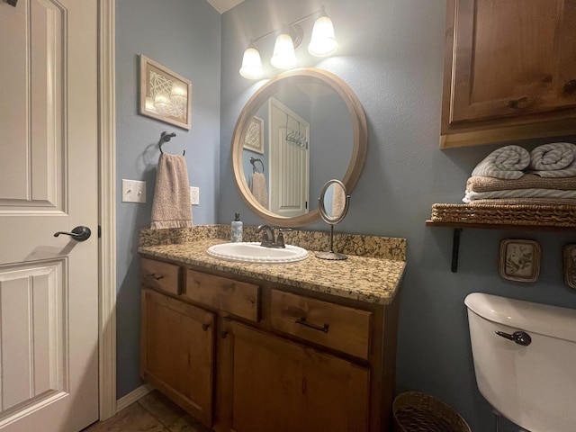 1021 W Whiteside St, Springfield, MO 65807 - half bathroom featuring vanity and toilet