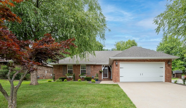 1021 W Whiteside St, Springfield, MO 65807 - single story home with a shingled roof, an attached garage, driveway, brick siding, and a front lawn