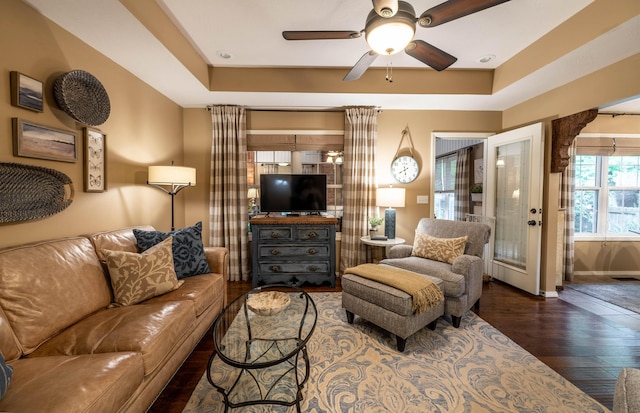 1021 W Whiteside St, Springfield, MO 65807 - living room featuring wood finished floors, ceiling fan, and a raised ceiling