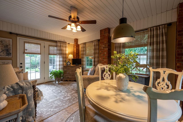 1021 W Whiteside St, Springfield, MO 65807 - dining room with healthy amount of natural light, ceiling fan, and brick wall