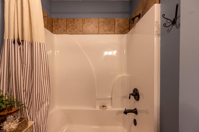 1021 W Whiteside St, Springfield, MO 65807 - bathroom with shower / tub combo with curtain