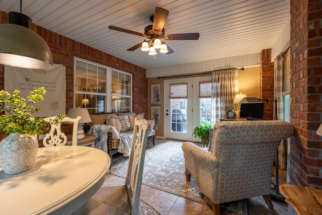 1021 W Whiteside St, Springfield, MO 65807 - living area with brick wall and ceiling fan