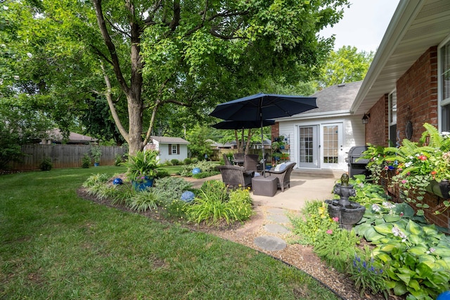 1021 W Whiteside St, Springfield, MO 65807 - view of yard with a patio area, an outbuilding, and french doors
