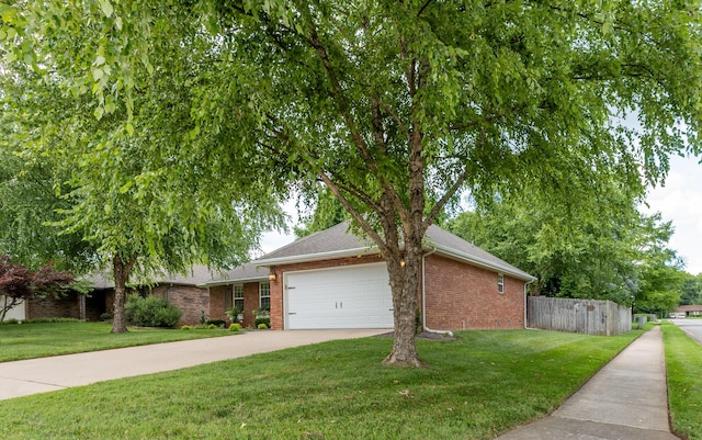 1021 W Whiteside St, Springfield, MO 65807 - view of front facade with a garage, brick siding, driveway, and a shingled roof