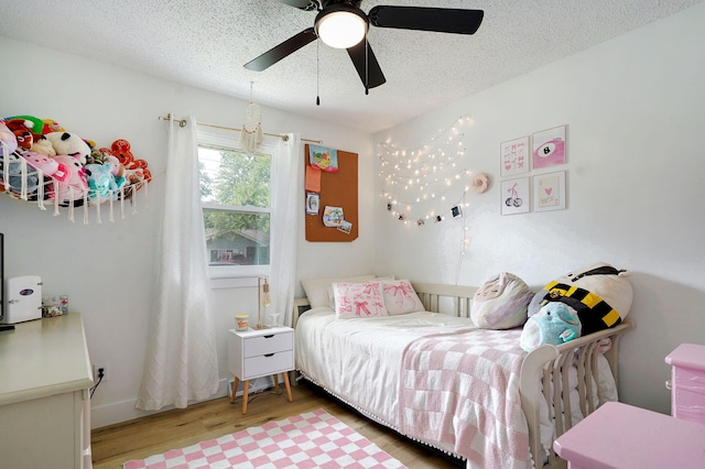 303 E Berkeley St, Springfield, MO 65807 - bedroom with wood finished floors, a textured ceiling, and ceiling fan