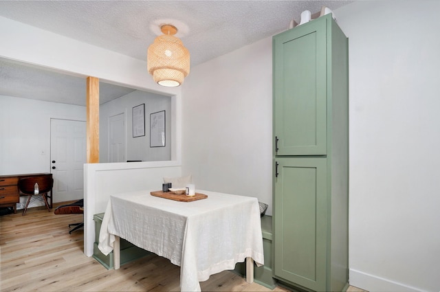 303 E Berkeley St, Springfield, MO 65807 - dining space featuring light wood-style floors and a textured ceiling