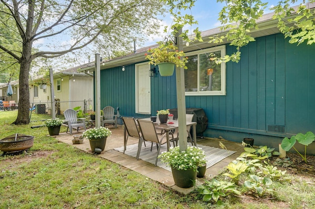303 E Berkeley St, Springfield, MO 65807 - view of patio / terrace with a fire pit