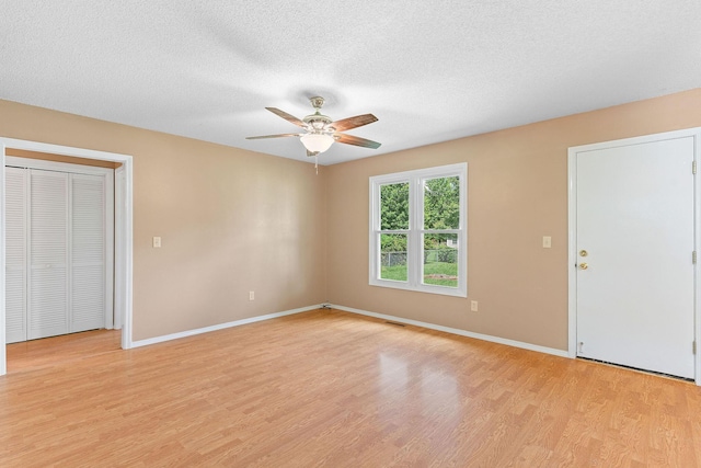 502 Sunrise St, Strafford, MO 65757 - empty room featuring light wood-style floors, a ceiling fan, and a textured ceiling