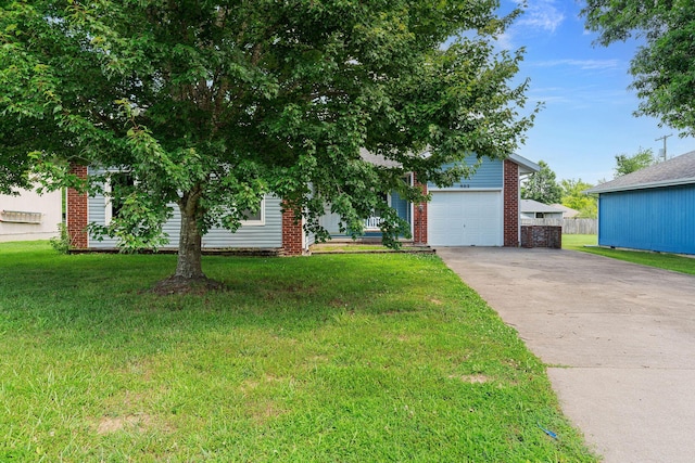 502 Sunrise St, Strafford, MO 65757 - view of property hidden behind natural elements with driveway, a garage, brick siding, and a front yard