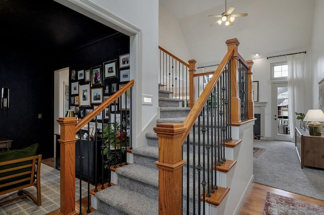 1421 N Rockingham Ave, Nixa, MO 65714 - stairs featuring wood finished floors, high vaulted ceiling, and a ceiling fan