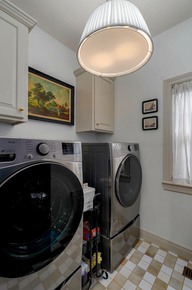 1421 N Rockingham Ave, Nixa, MO 65714 - laundry area with washer and clothes dryer and cabinet space