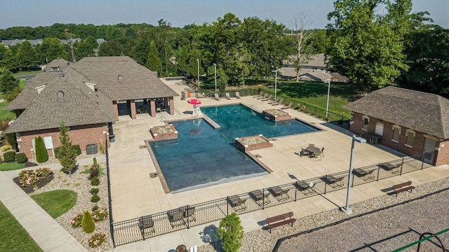 1421 N Rockingham Ave, Nixa, MO 65714 - community pool with a patio area and an outbuilding