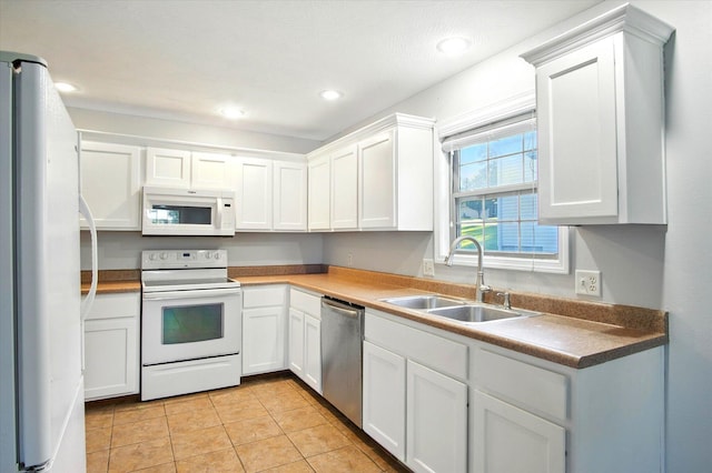 184 Crestwood Dr, Marshfield, MO 65706 - kitchen with white appliances, white cabinets, light tile patterned floors, and recessed lighting