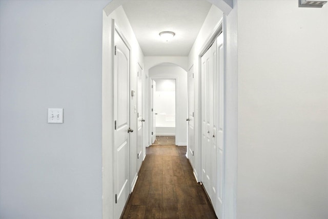 184 Crestwood Dr, Marshfield, MO 65706 - corridor featuring arched walkways and dark wood-style floors
