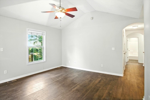 184 Crestwood Dr, Marshfield, MO 65706 - unfurnished room with arched walkways, vaulted ceiling, a ceiling fan, and dark wood-style floors