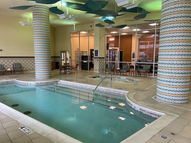 200 S Sycamore St Unit 902, Branson, MO 65616 - indoor pool featuring decorative columns and a hot tub