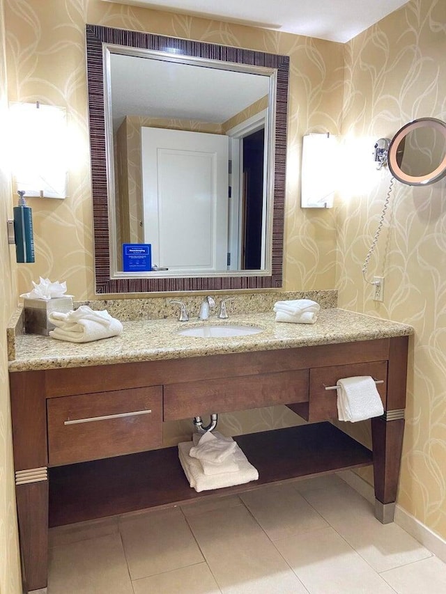 200 S Sycamore St Unit 902, Branson, MO 65616 - bathroom with wallpapered walls, vanity, and tile patterned flooring
