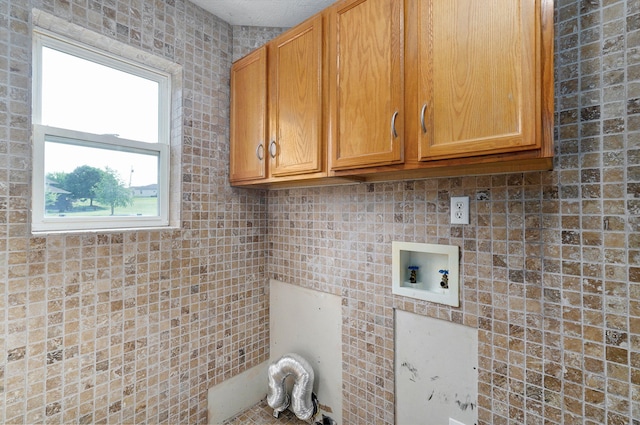2001 S 16th Ave, Ozark, MO 65721 - laundry room featuring cabinet space and washer hookup