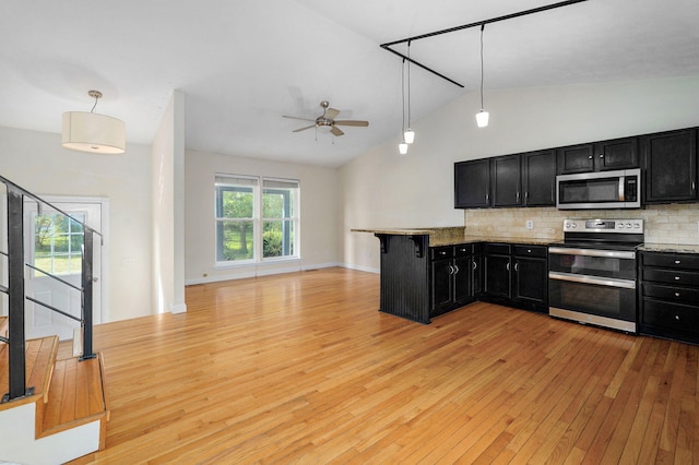 2001 S 16th Ave, Ozark, MO 65721 - kitchen with dark cabinetry, stainless steel appliances, ceiling fan, light wood finished floors, and open floor plan
