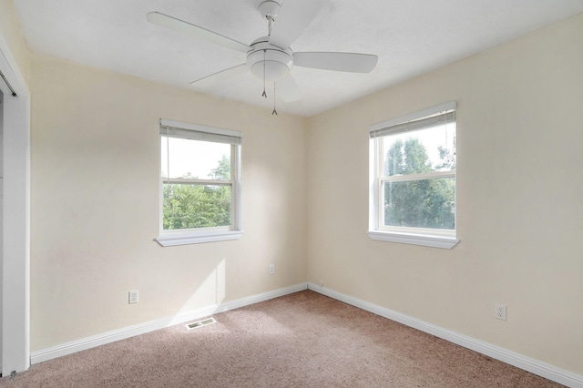 2001 S 16th Ave, Ozark, MO 65721 - carpeted empty room with plenty of natural light and a ceiling fan