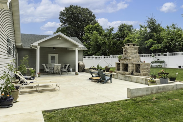 120 E Kennedy Blvd, Buffalo, MO 65622 - fenced backyard featuring an outdoor fireplace, a patio area, and outdoor dining space