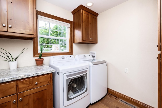 120 E Kennedy Blvd, Buffalo, MO 65622 - laundry area with cabinet space, separate washer and dryer, and wood finished floors