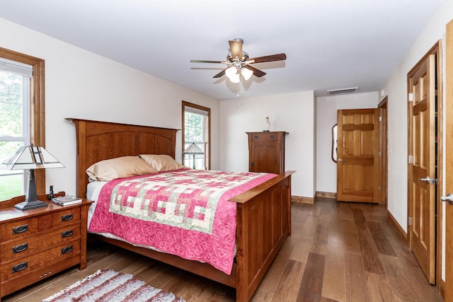120 E Kennedy Blvd, Buffalo, MO 65622 - bedroom featuring dark wood-style flooring, multiple windows, and ceiling fan