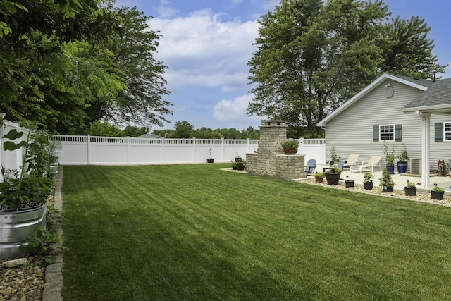 120 E Kennedy Blvd, Buffalo, MO 65622 - fenced backyard with a patio and an outdoor brick fireplace