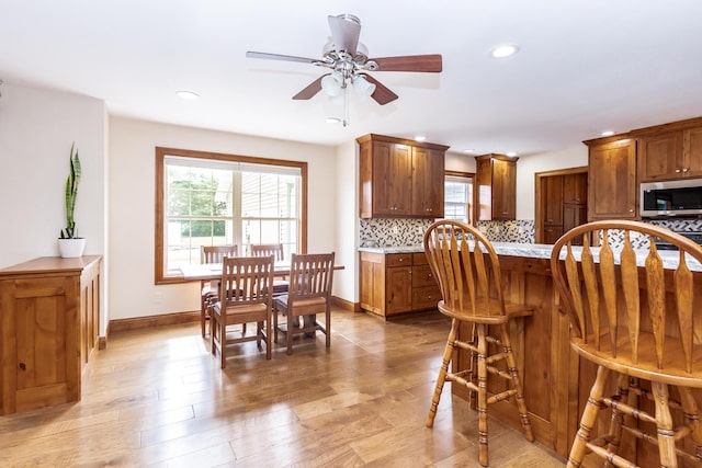 120 E Kennedy Blvd, Buffalo, MO 65622 - kitchen with light countertops, healthy amount of natural light, tasteful backsplash, ceiling fan, and recessed lighting