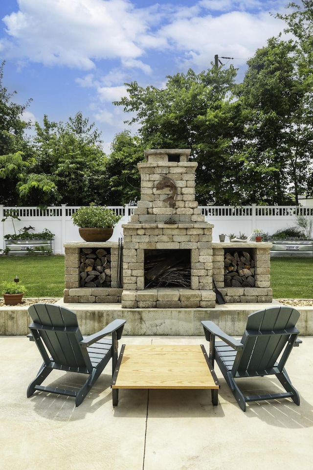 120 E Kennedy Blvd, Buffalo, MO 65622 - view of patio with an outdoor stone fireplace