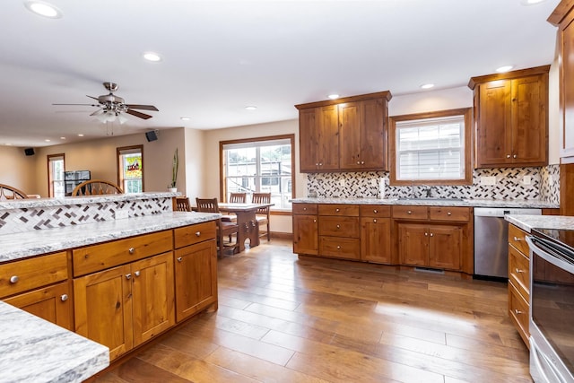 120 E Kennedy Blvd, Buffalo, MO 65622 - kitchen with ceiling fan, appliances with stainless steel finishes, backsplash, brown cabinets, and recessed lighting
