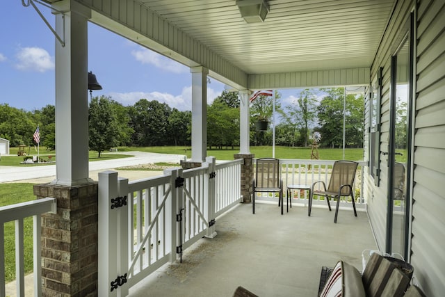 120 E Kennedy Blvd, Buffalo, MO 65622 - covered porch with view of wooded area