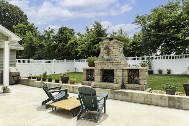 120 E Kennedy Blvd, Buffalo, MO 65622 - fenced backyard featuring an outdoor stone fireplace and a patio
