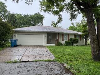 315 S Market St, Nixa, MO 65714 - ranch-style house with an attached garage, concrete driveway, and a front yard