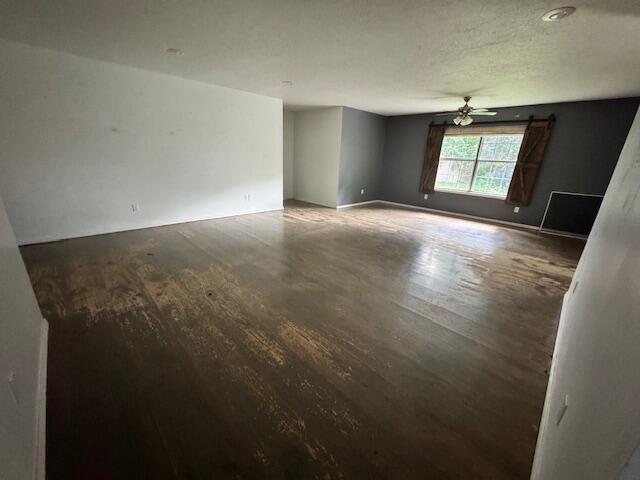 315 S Market St, Nixa, MO 65714 - spare room featuring wood finished floors and a ceiling fan