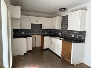 315 S Market St, Nixa, MO 65714 - kitchen with decorative backsplash, dark wood-style floors, and white cabinets