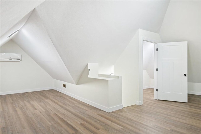 1156 W Lynn St, Springfield, MO 65802 - bonus room featuring vaulted ceiling, wood finished floors, and a wall unit AC