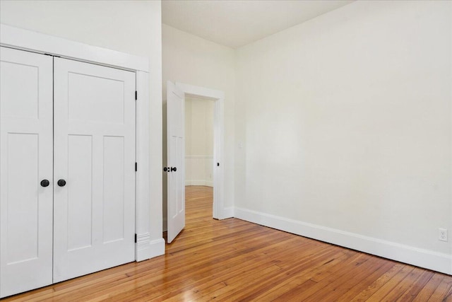 1156 W Lynn St, Springfield, MO 65802 - unfurnished bedroom featuring light wood-type flooring and a closet