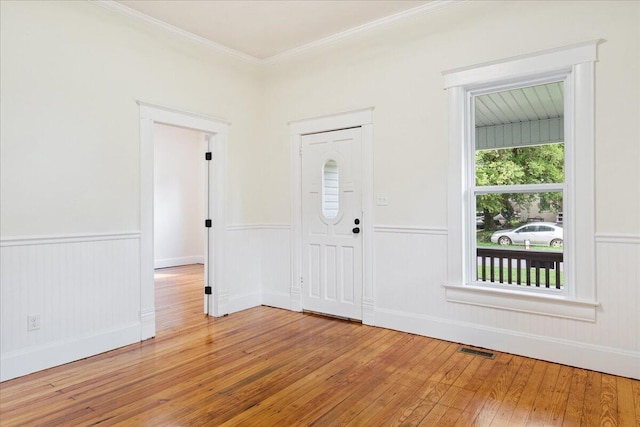 1156 W Lynn St, Springfield, MO 65802 - entrance foyer featuring light wood-type flooring, wainscoting, and ornamental molding