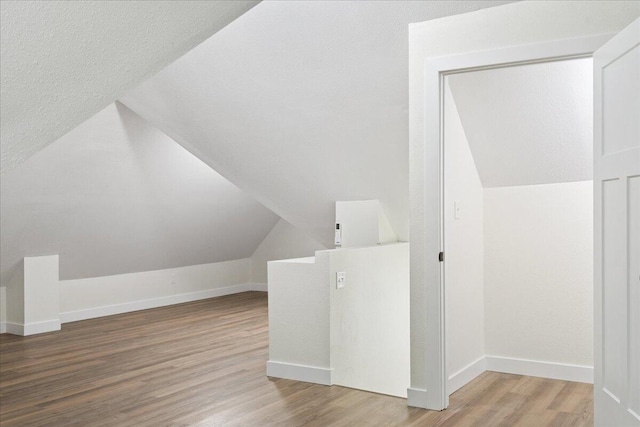 1156 W Lynn St, Springfield, MO 65802 - additional living space featuring wood finished floors and vaulted ceiling