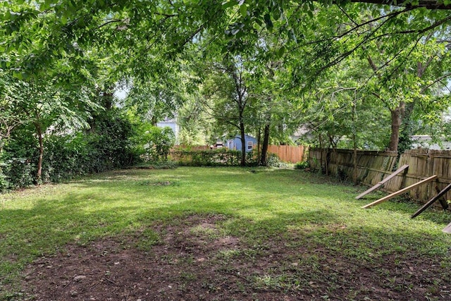 1156 W Lynn St, Springfield, MO 65802 - fenced backyard with a storage unit