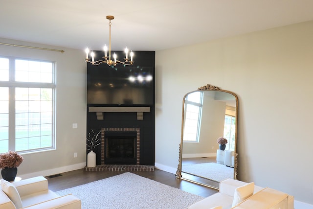 1224 S Mulberry Ave, Springfield, MO 65802 - living area featuring a chandelier, healthy amount of natural light, and wood finished floors