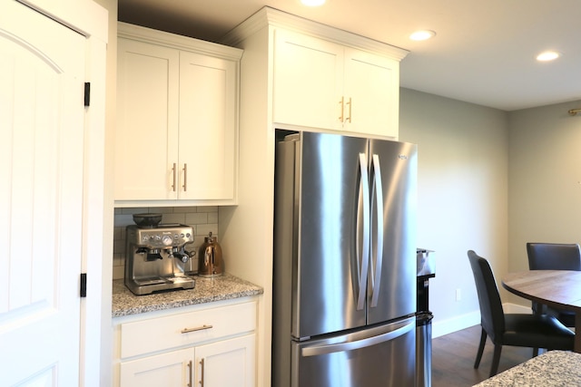 1224 S Mulberry Ave, Springfield, MO 65802 - kitchen featuring freestanding refrigerator, recessed lighting, backsplash, dark wood-style flooring, and white cabinetry