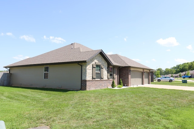 1224 S Mulberry Ave, Springfield, MO 65802 - view of front facade featuring an attached garage, concrete driveway, stone siding, and a front yard