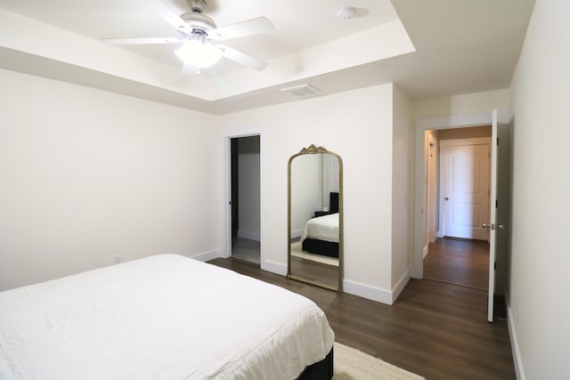 1224 S Mulberry Ave, Springfield, MO 65802 - bedroom featuring dark wood-style floors, a raised ceiling, and a ceiling fan