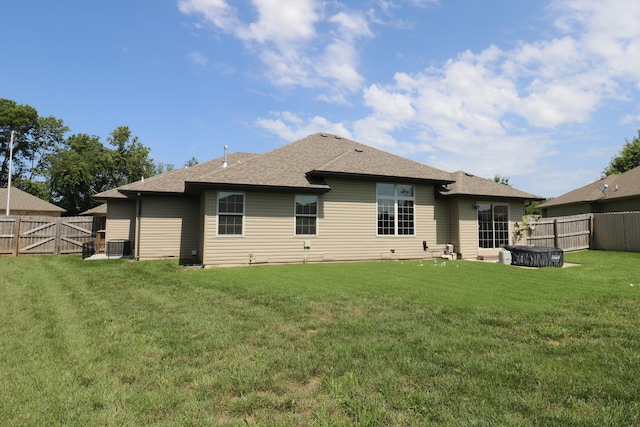 1224 S Mulberry Ave, Springfield, MO 65802 - rear view of property featuring a shingled roof, a fenced backyard, and a gate